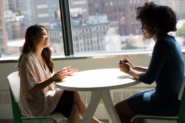 Two colleagues talking through a technology decision