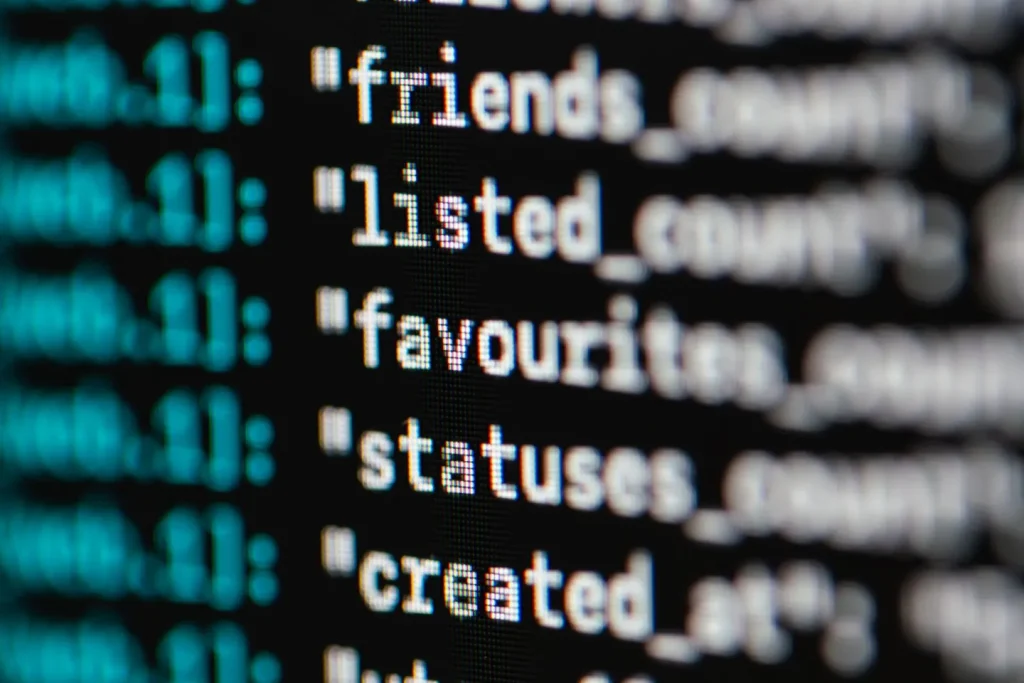 Engineers reviewing connected systems together on laptops