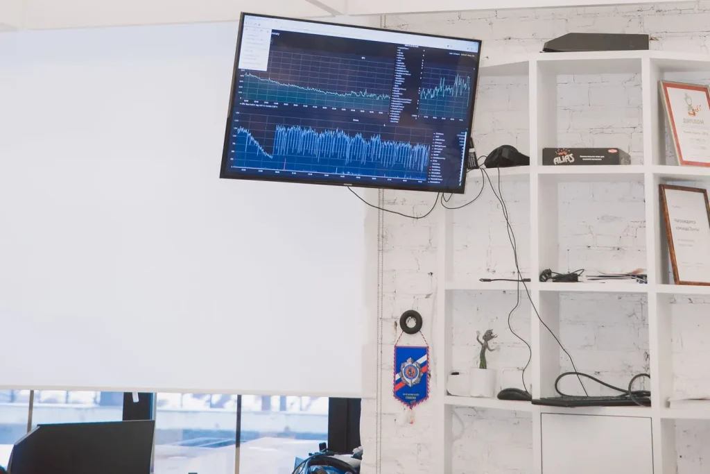 Two people reviewing a printed field mapping across a desk