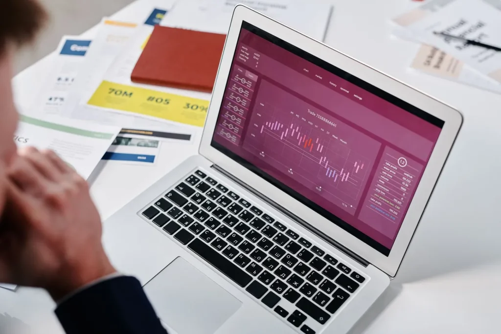 Two people reviewing a printed field mapping across a desk